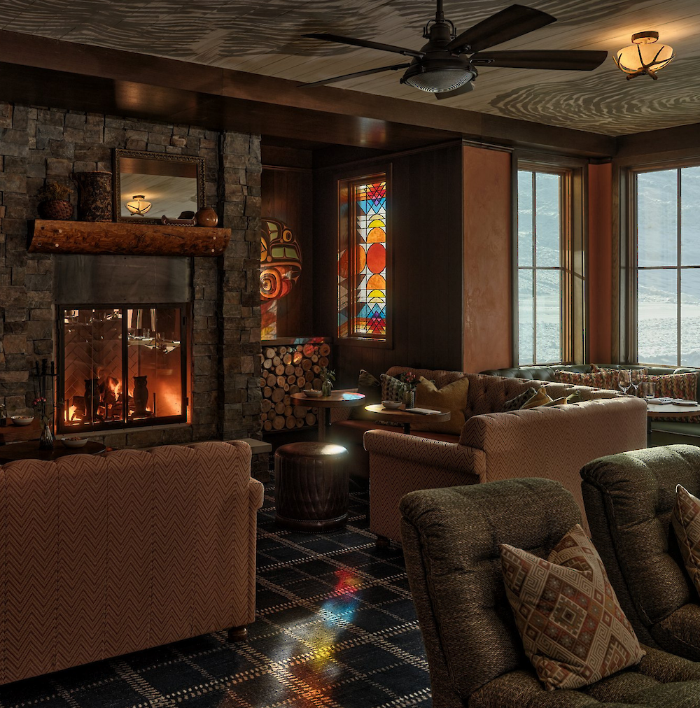 A view of the fireplace and out the window in the Living Room of the Inn.