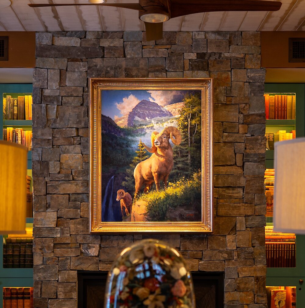 An art piece on the wall of an Owl in the Inn.
