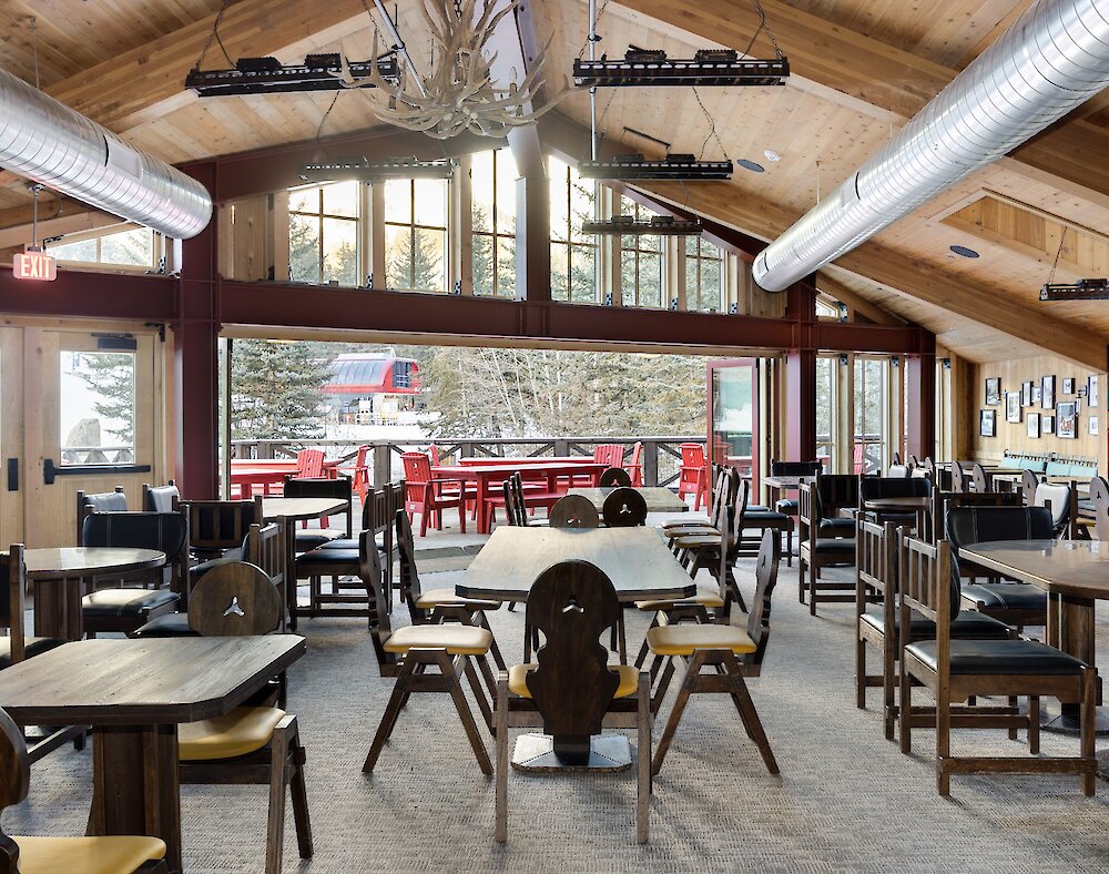A view from inside The Lookout restaurant out the windows to the lift and mountain.