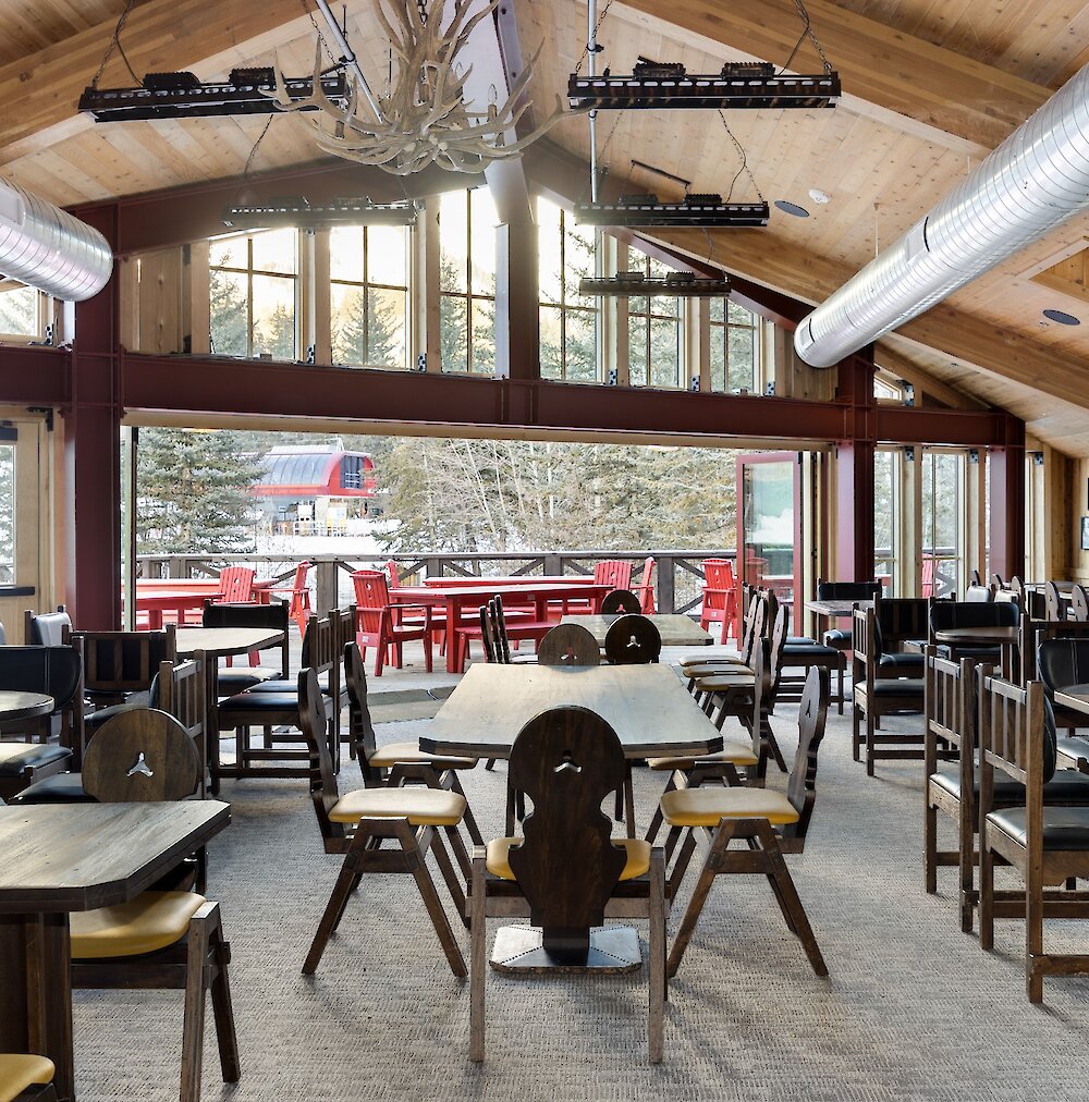 A view from inside The Lookout restaurant out the windows to the lift and mountain.