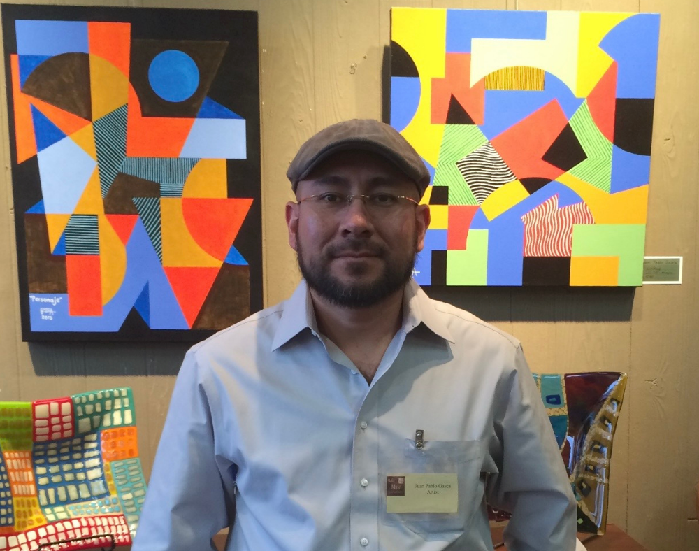 Kim Daw with her art and dog.