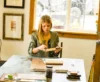 A woman creating a masterpiece in the Sundance Art Studio.