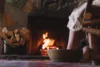 feet soaking in water in front of a nicely lit fireplace