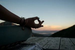 Morning yoga with a stunning view of the sunrising over the mountains.