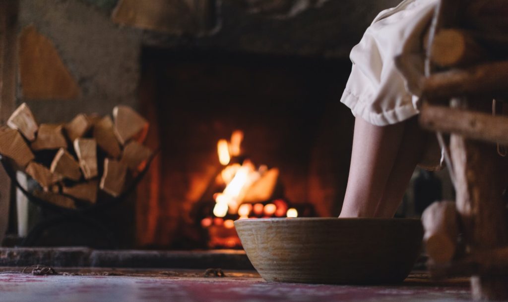 Soak your feet while relaxing next to a cozy wood-burning fireplace.