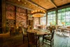 Rustic dining area in the Foundry Grill with large windows that allow for plenty of natural light.