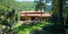 Event hall with a beautiful courtyard nestled between the lush green mountains.