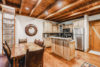 Full-size kitchen complete with modern appliances and a table for six.