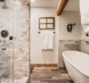 Contemporary bathroom complete with large tub and shower.