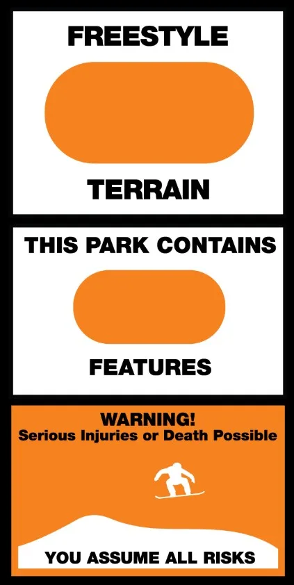 Sign with three sections: "Freestyle Terrain" above an orange oval, "This Park Contains Features" in black text, and "Warning! Serious Injuries or Death Possible" with a snowboarder icon on a slope. Text: "You Assume All Risks" at bottom.