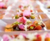 A catering line up of summer salads boasting vibrant colors and fresh ingredients.