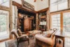 Rustic living room with sliding glass doors leading onto the deck.