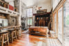 Plenty of natural streaming into the rustic-inspired living room and kitchen of Dream Catcher cabin.