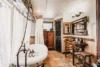 Exquisite free-standing tub with decorative vanity in this vintage-inspired bathroom.