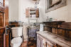 Rustic bathroom with a cool antique sink in Owl Spirit cabin.