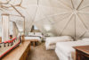 Loft area with geometric vaulted ceiling and 3 additional beds.