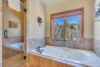 Large bathtub with jets and a wonderful view of the mountains.