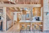 Full-size kitchen with a staircase off to the side leading to the loft area.