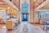 Beautiful entryway at Red Hawk Cabin with the kitchen and dining area on either side.