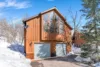 Wintery outdoor view of the Red Hawk Cabin at Sundance Resort.