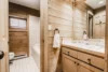 Neat bathroom with neutral tones and a tiled shower.