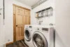 Simple laundry room with modern washer and dryer appliances.