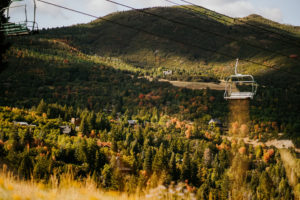 Beautiful view of a Sundance ski lift in the summer with the mountains in the background.
