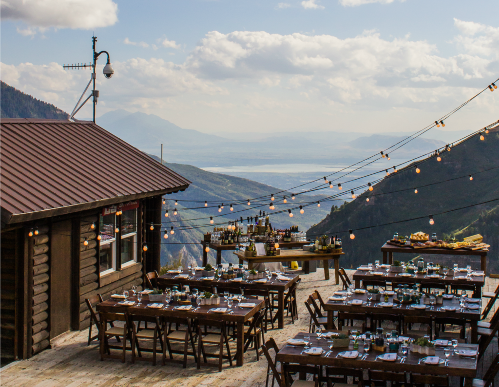 Outdoor dining area at Bearclaw with an impressive view of the mountains.