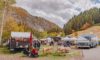 Gorgeous fall day at the harvest market with many vendor tents and a food truck.