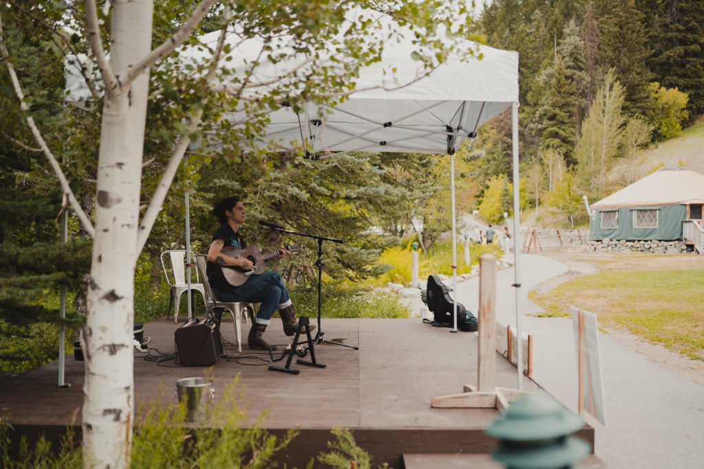 A solo musician takes the stage at our free outdoor summer music event.