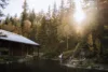 The sun rises over the pond and Rehearsal Hall at Sundance Resort.