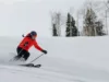 A woman quickly skis down the slopes at Sundance Resort.