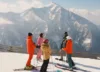 A group of skiers gathers at the top of the Sundance slopes.