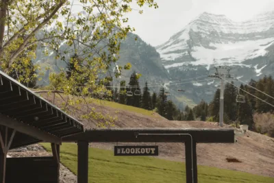 A scenic view at a lookout point featuring a wooden sign labeled 