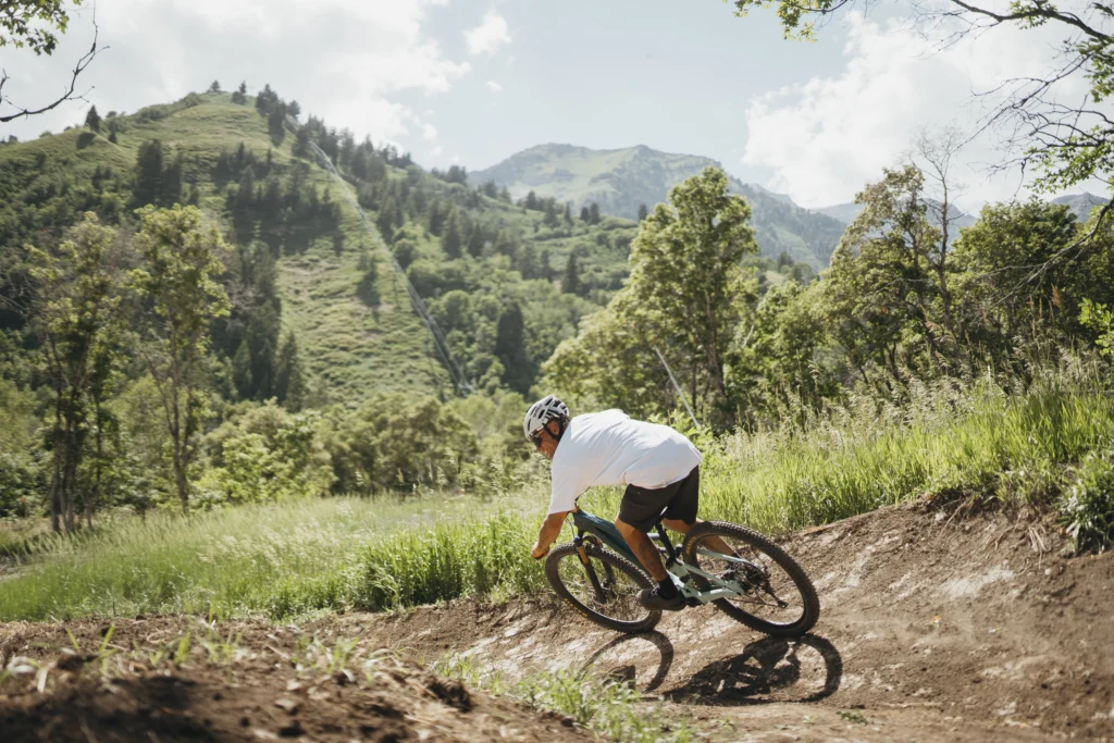 A mountain biker speeds down the new trails at Sundance Mountain Resort. 