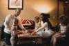 A family sitting together in a living room, with parents playing with their three children who are engaged with colorful building blocks on the table, discussing their upcoming Utah vacation packages.