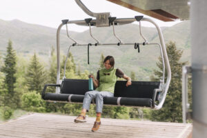 Girl riding chair lift